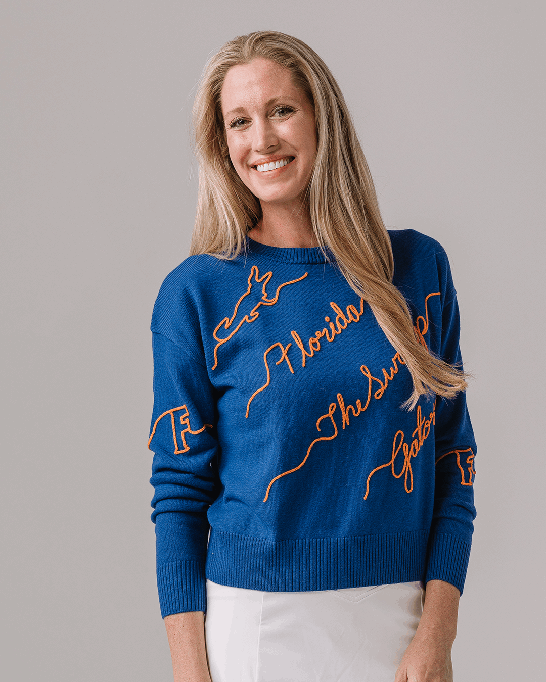 blue and orange NCAA crewneck sweater with Florida Gators embroidered logo, perfect for campus wear 