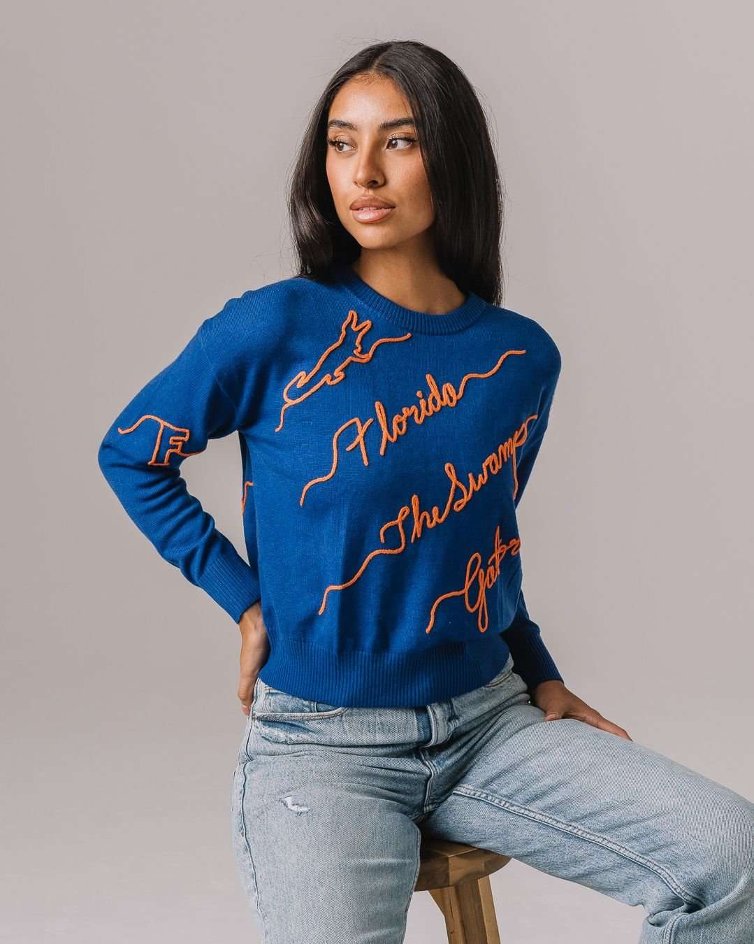 blue and orange NCAA crewneck sweater with Florida Gators embroidered logo, perfect for campus wear 