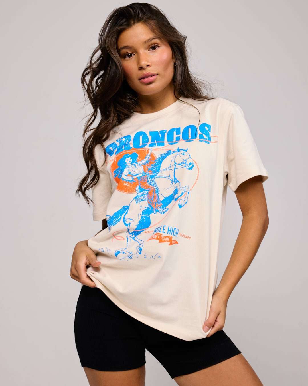 game changers womens tee with denver broncos hand-drawn logo, styled for game day, casual wear, and tailgates.