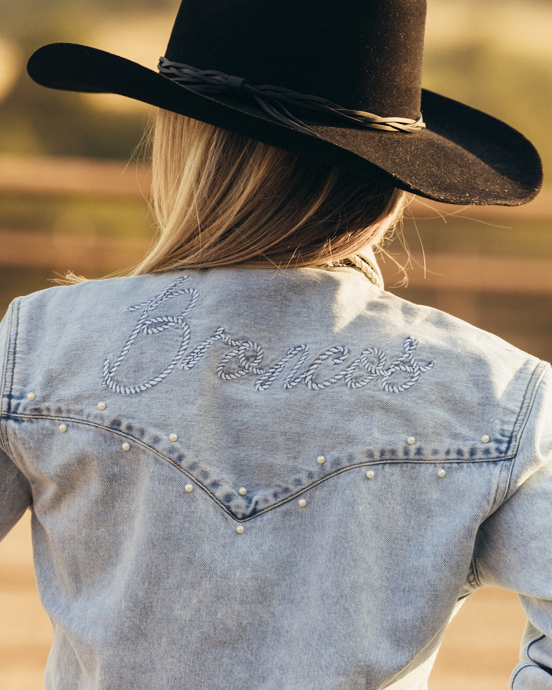 denim pearl snap womens shirt with denver broncos embroidery, styled for game day, casual wear, and tailgates.