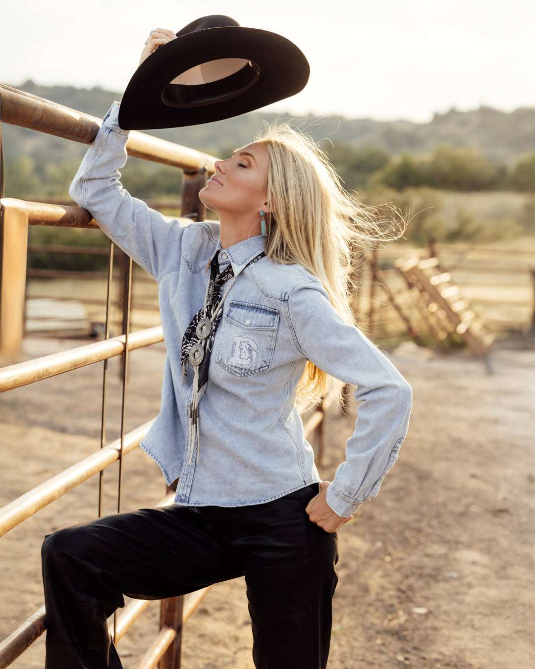 denim pearl snap womens shirt with denver broncos embroidery, styled for game day, casual wear, and tailgates.