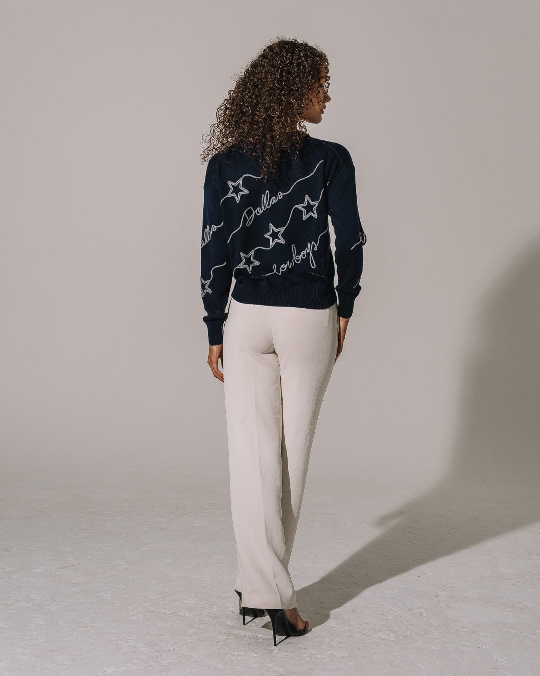 Navy crewneck sweater featuring Dallas Cowboys chain stitch emblem, perfect for tailgates, game days, and lounging.