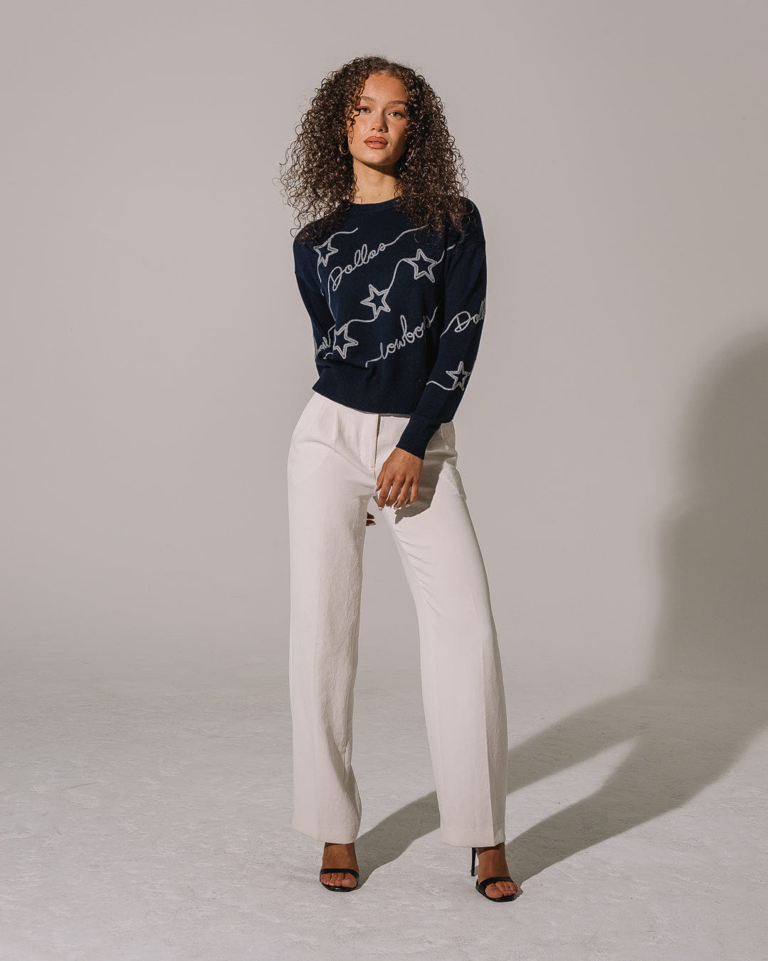 Navy crewneck sweater featuring Dallas Cowboys chain stitch emblem, perfect for tailgates, game days, and lounging.