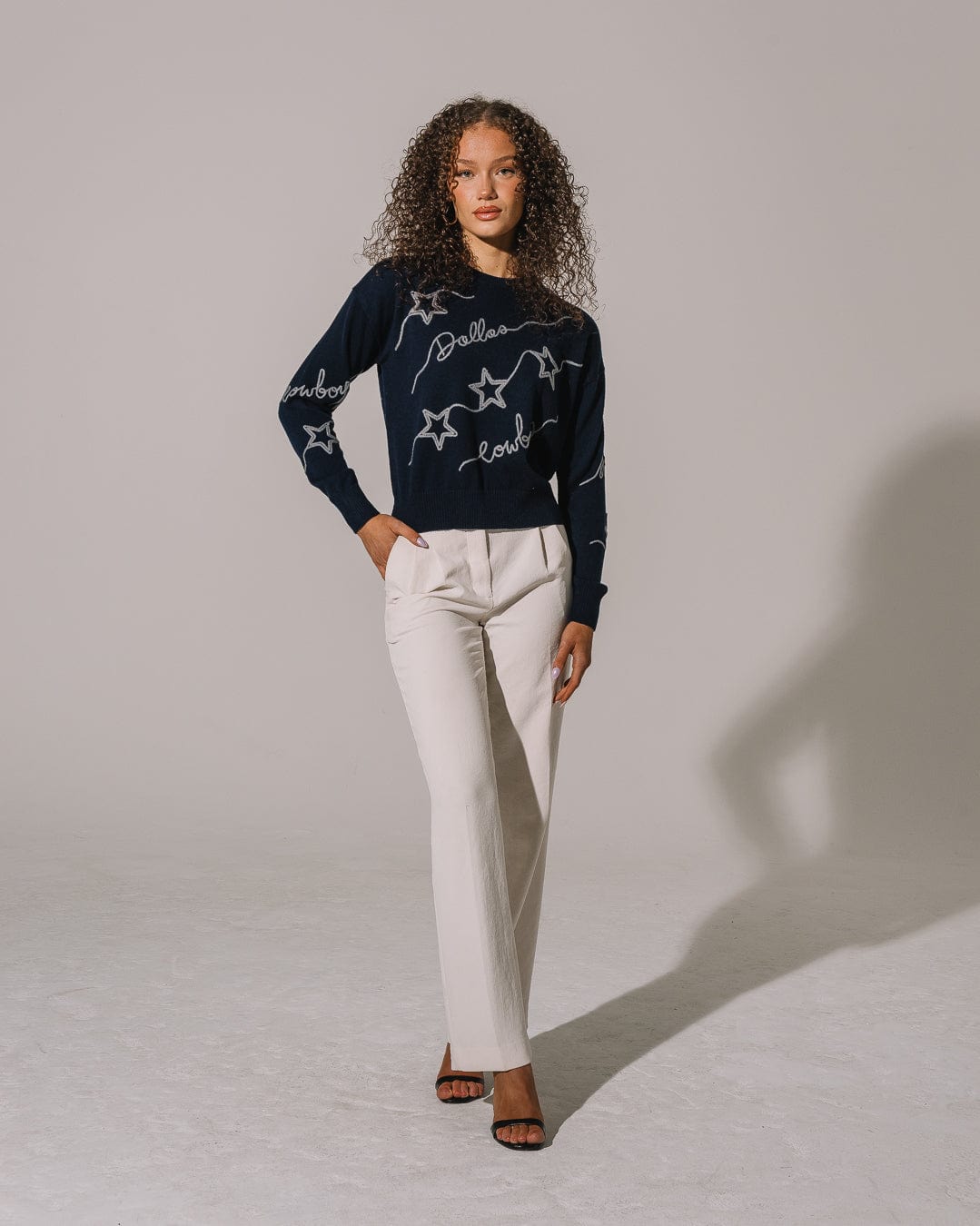 Navy crewneck sweater featuring Dallas Cowboys chain stitch emblem, perfect for tailgates, game days, and lounging.