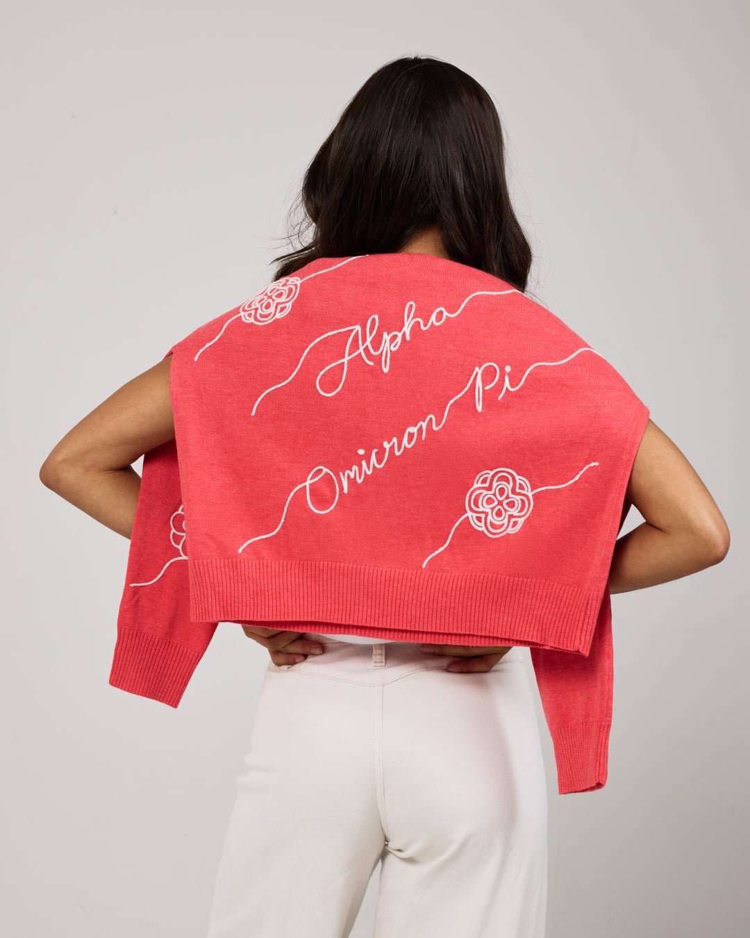 pink and white long sleeve sorority sweater with Alpha Omicron Pi embroidered logo, perfect for sorority rush