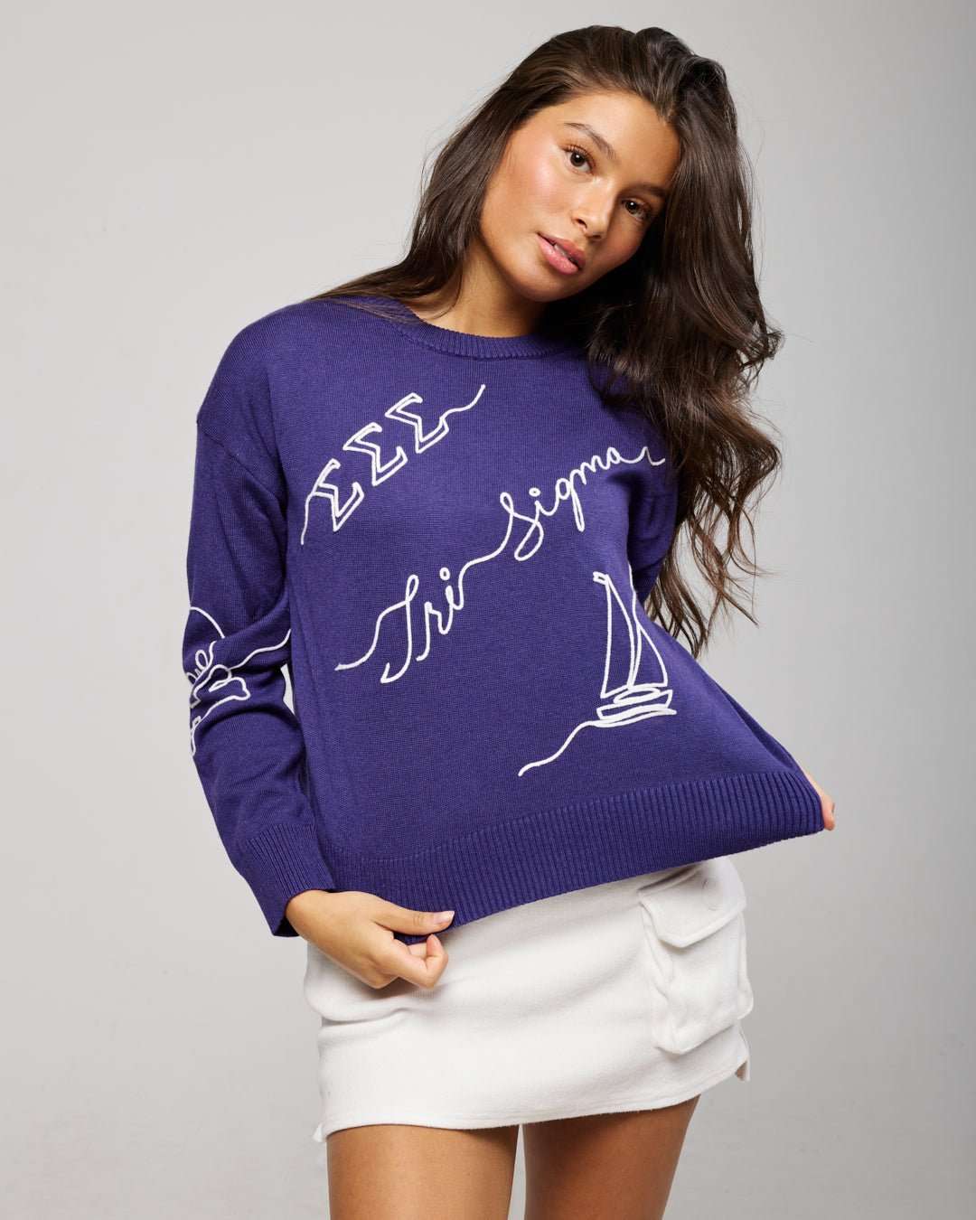 purple and white crewneck sorority sweater with Tri Sigma embroidered logo, perfect for college graduation photoshoot