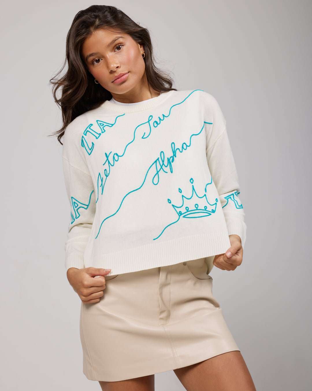white and blue crewneck sorority sweater with Zeta Tau Alpha embroidered logo, perfect for sorority philanthropy event