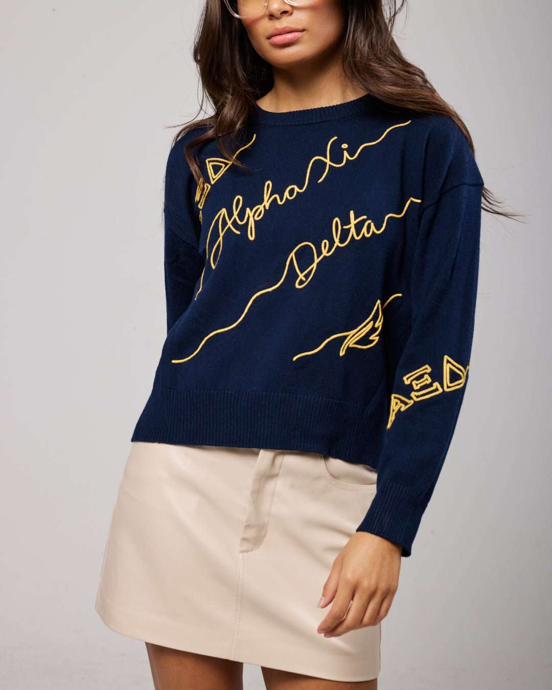 navy and gold long sleeve sorority sweater with Alpha Xi Delta embroidered logo, perfect for sorority alumni events