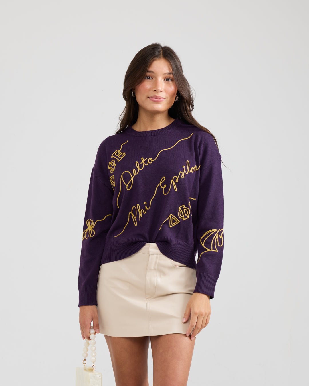 purple and gold crewneck sorority sweater with Delta Phi Epsilon embroidered logo, perfect for sorority recruitment