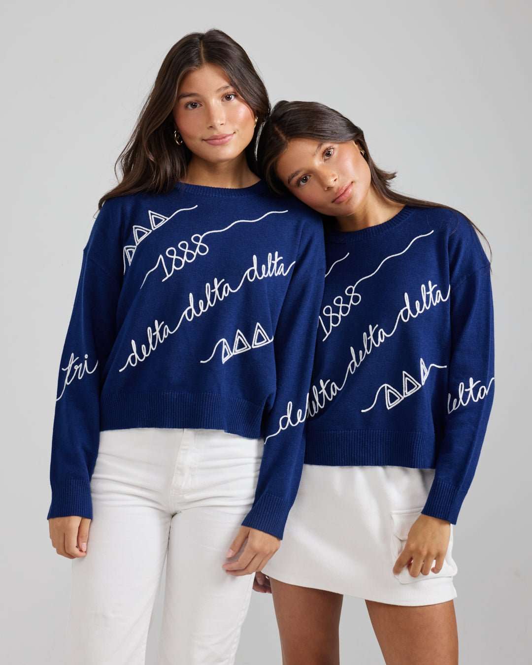 blue and white long sleeve sorority sweater with Tri Delta embroidered logo, perfect for sorority alumni tailgate