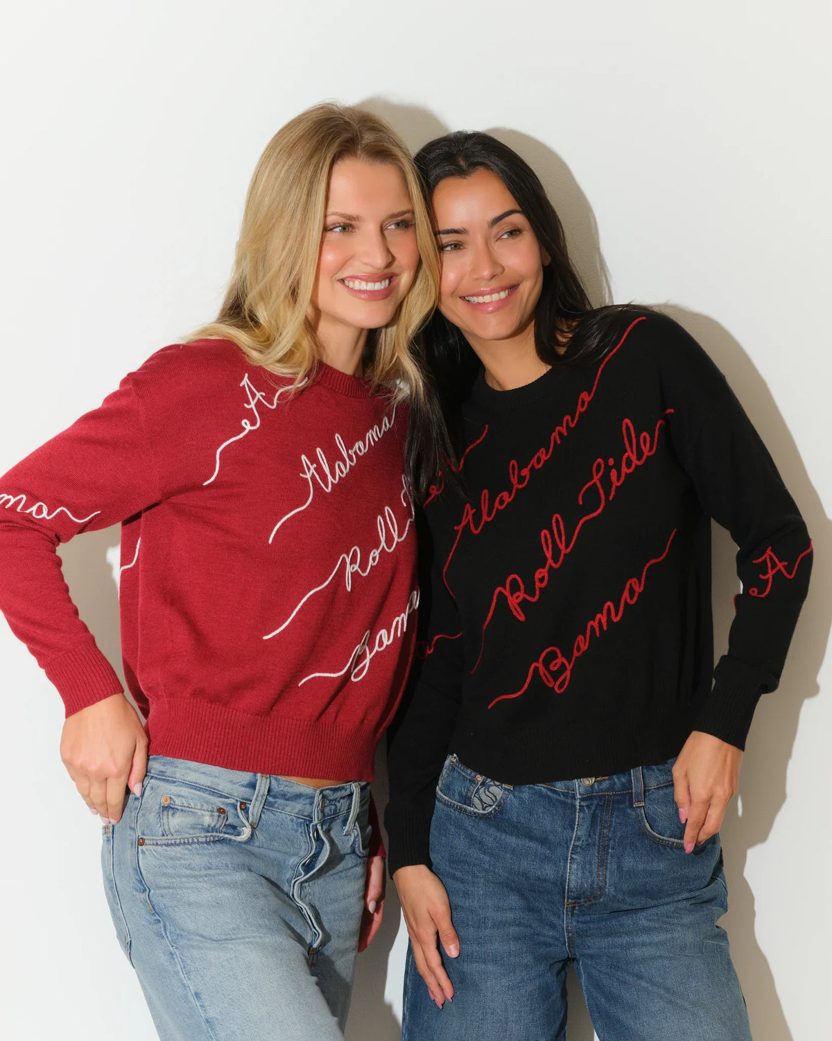 Black Alabama Crimson Tide Love Letter Sweater with red cursive script reading "Alabama," "Roll Tide," and "Bama" across the front and sleeves.