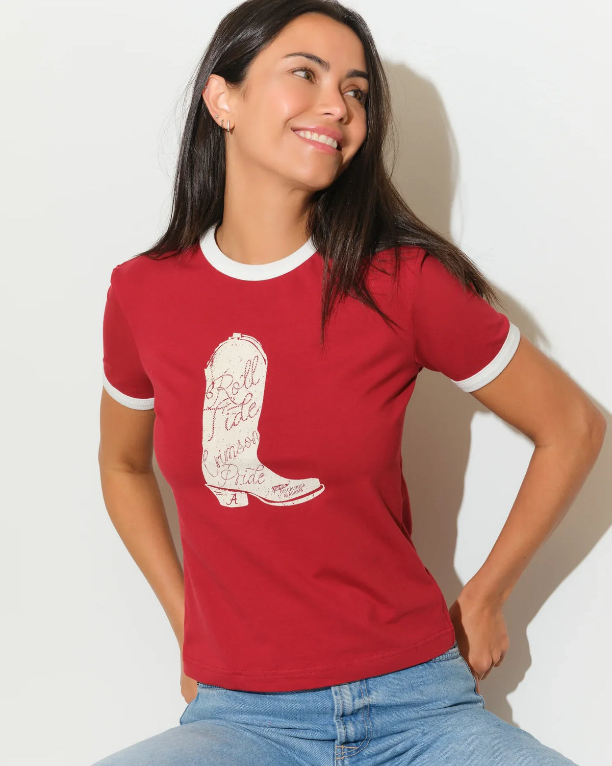 Crimson Alabama Crimson Tide women's ringer tee with white trim and a embroidered-style cowboy boot graphic on the chest.