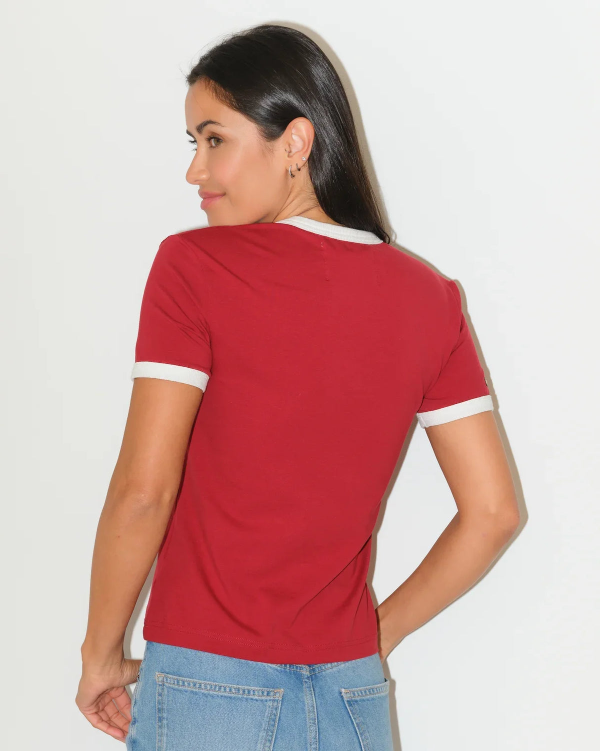 Crimson Alabama Crimson Tide women's ringer tee with white trim and a embroidered-style cowboy boot graphic on the chest.