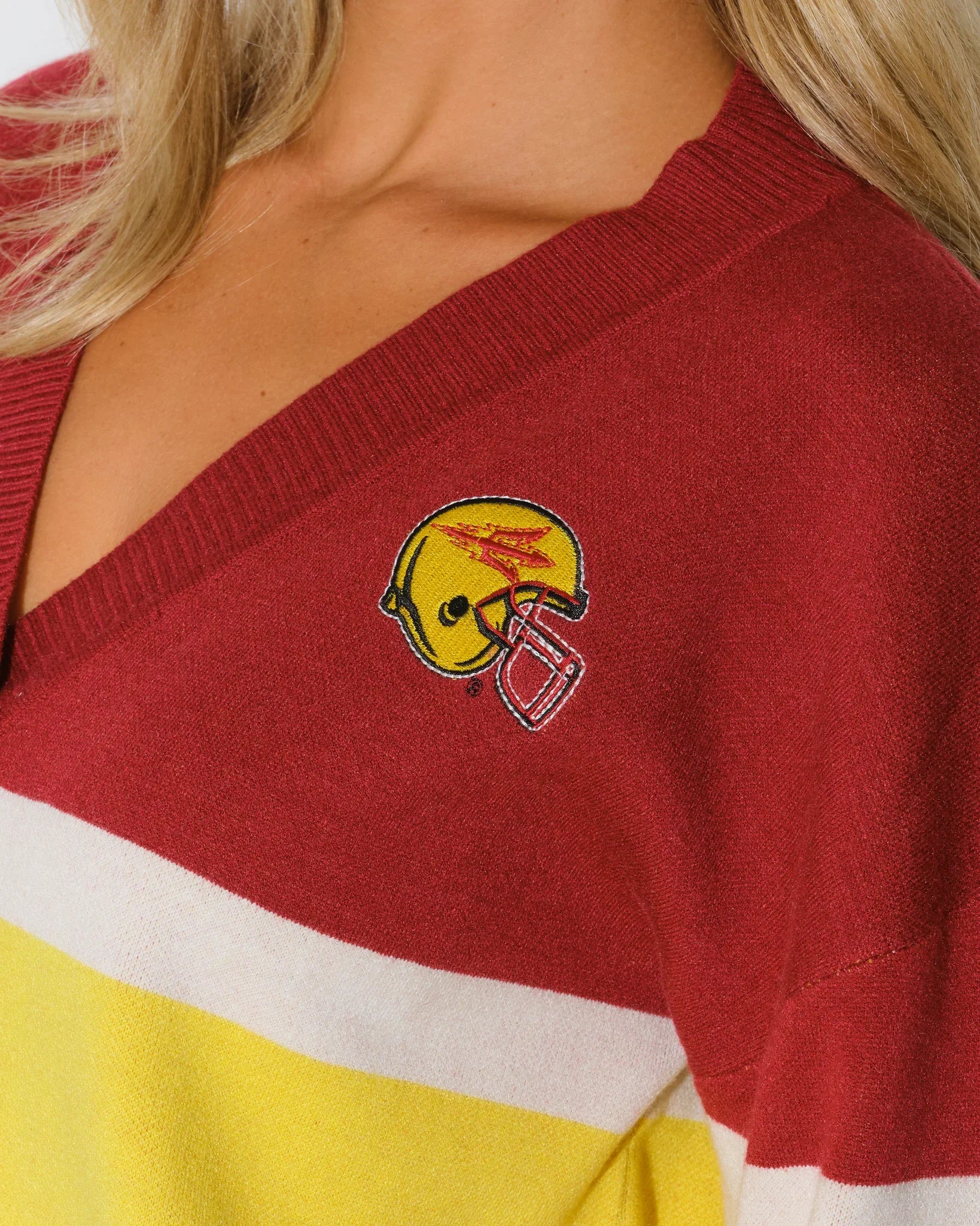 Black Arizona State Sun Devils cardigan with gold and white chest stripes, embroidered logo patch, button front, and front pockets.