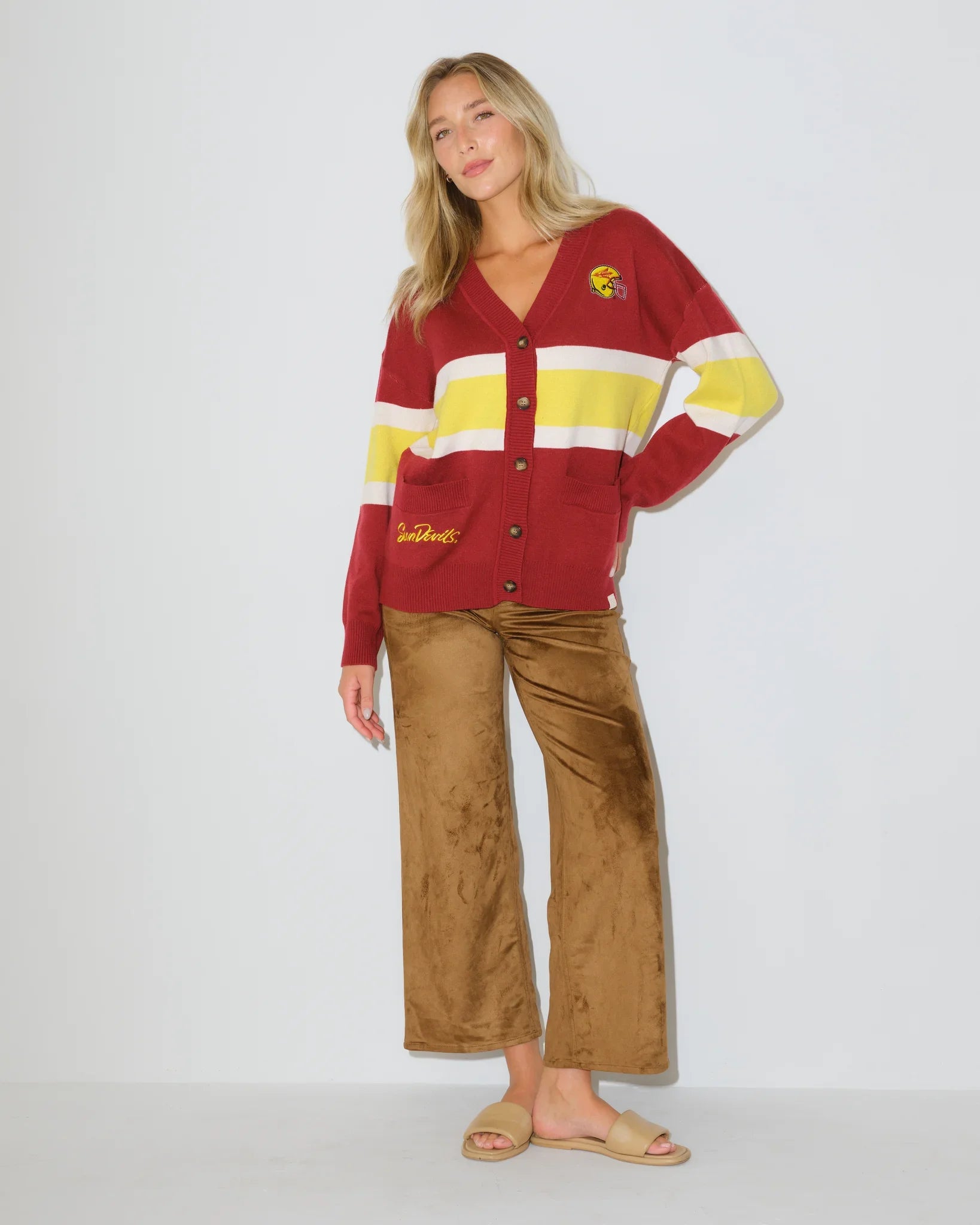 Black Arizona State Sun Devils cardigan with gold and white chest stripes, embroidered logo patch, button front, and front pockets.