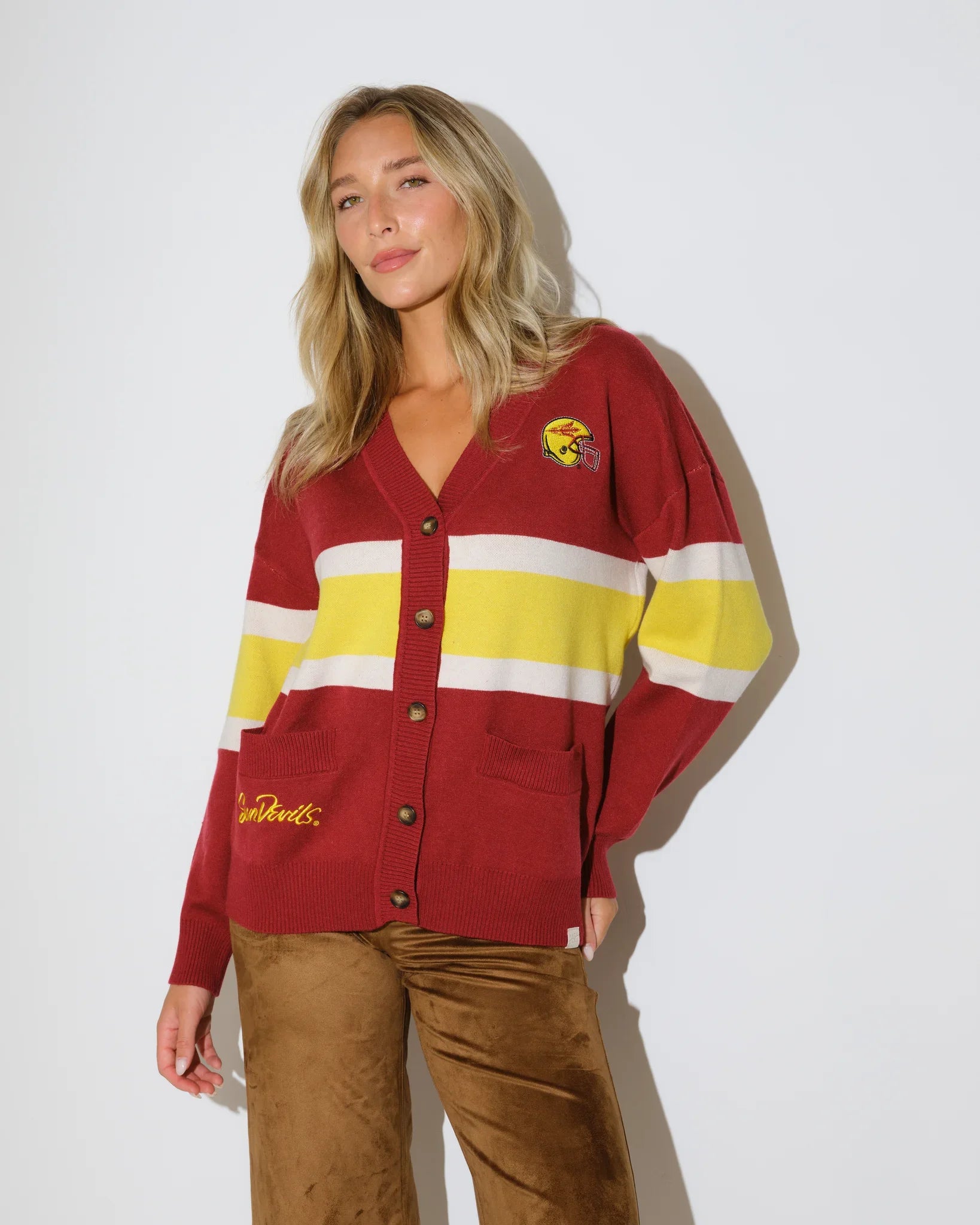Black Arizona State Sun Devils cardigan with gold and white chest stripes, embroidered logo patch, button front, and front pockets.