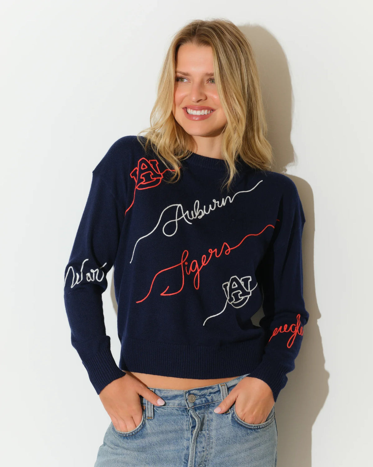 Navy Auburn Tigers Love Letter Sweater with red and white cursive script and floral embroidery details on a cropped crewneck silhouette.