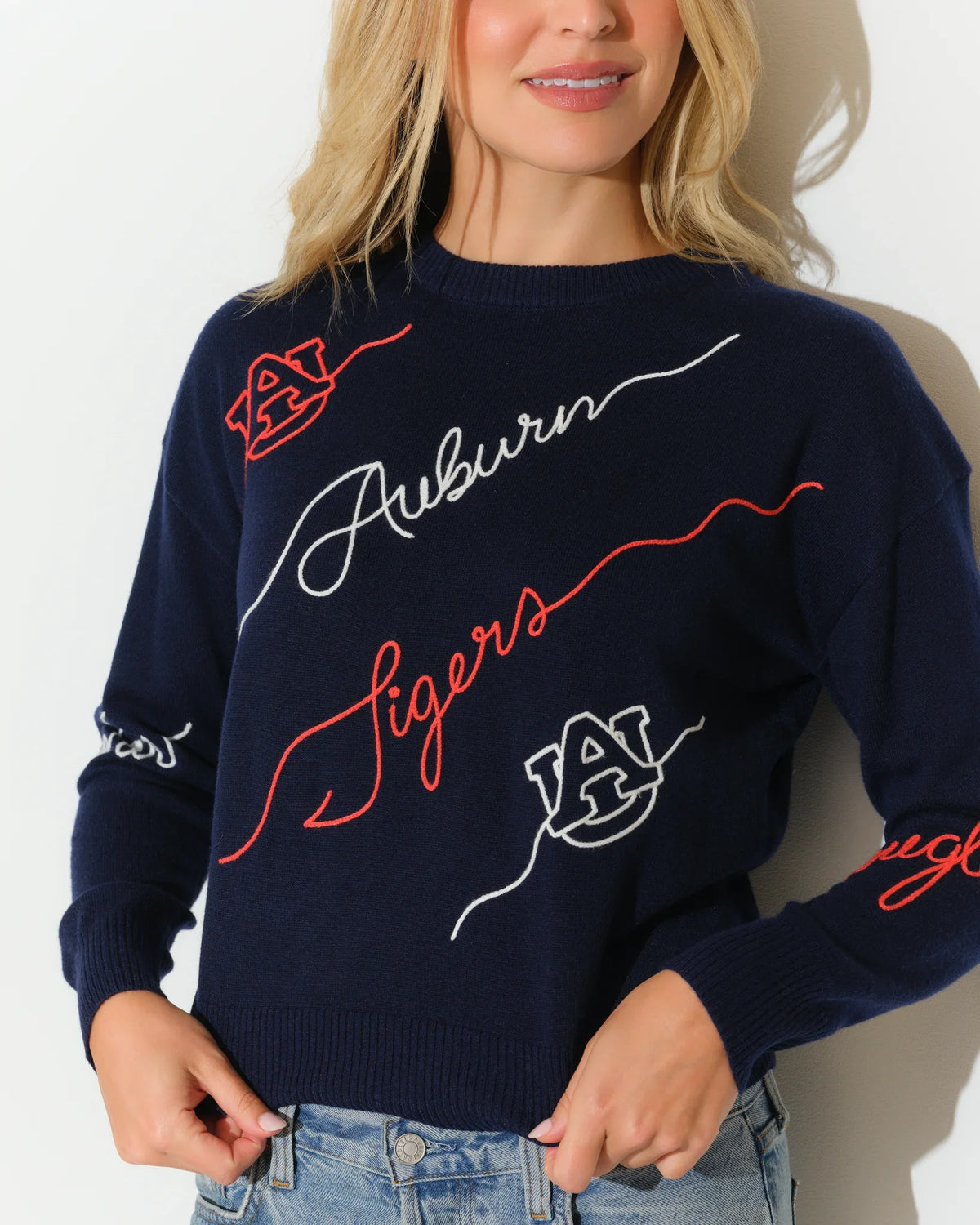 Navy Auburn Tigers Love Letter Sweater with red and white cursive script and floral embroidery details on a cropped crewneck silhouette.