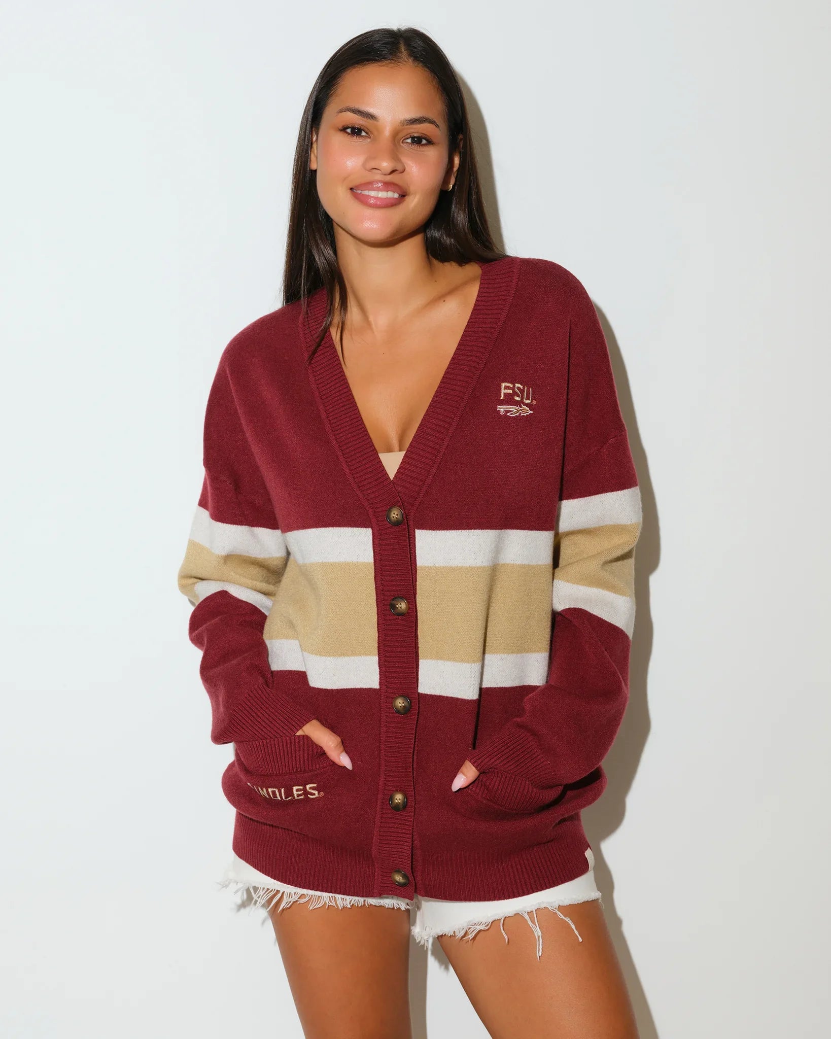 Maroon Florida State Seminoles oversized cardigan with tan and cream chest stripes, button front, and embroidered team lettering on the chest and sleeve.