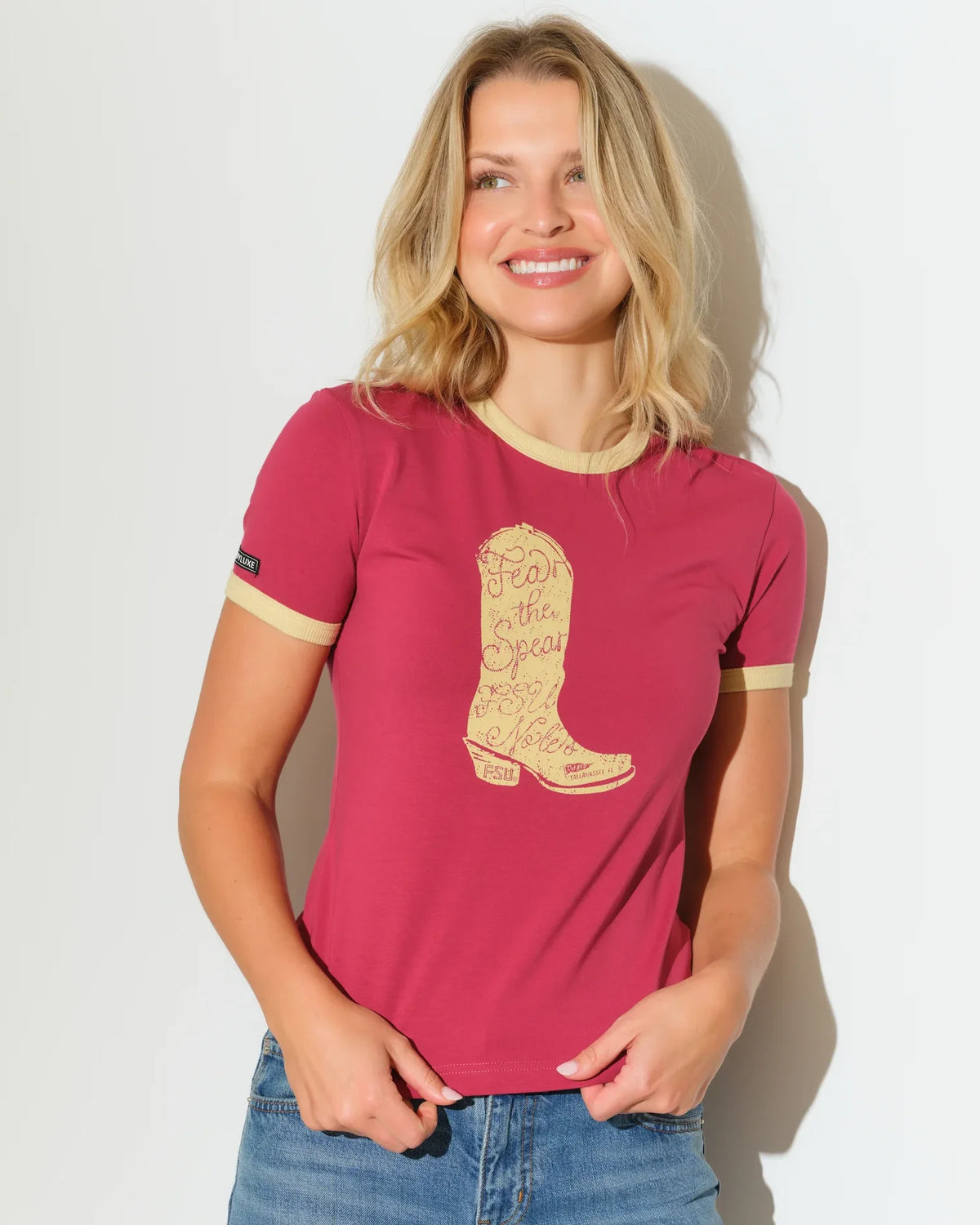 Maroon Florida State Seminoles women's ringer tee with gold trim and a large embroidered-style cowboy boot graphic on the chest.
