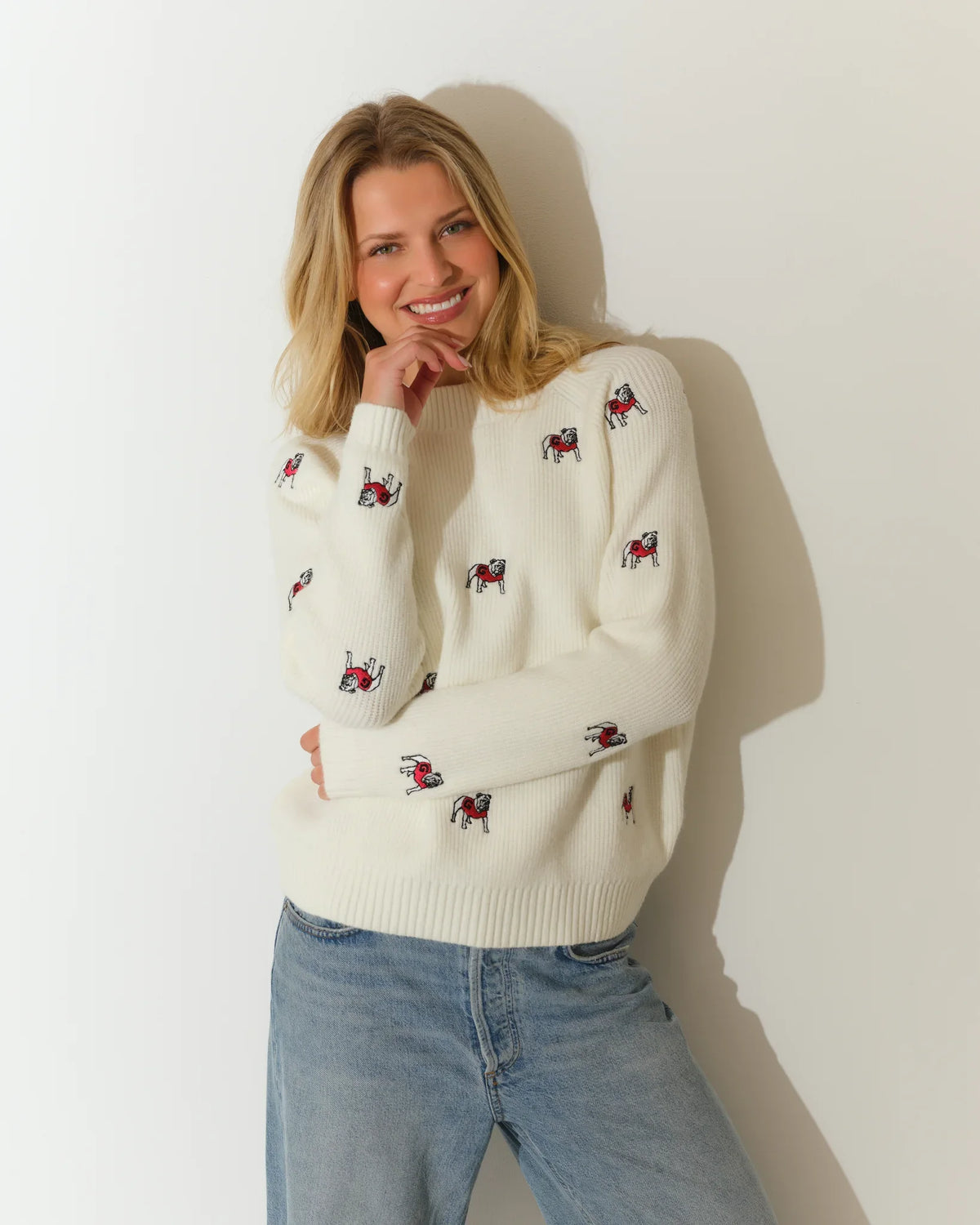 Ivory Georgia Bulldogs fisherman sweater with allover embroidered bulldog mascots, featuring a crew neck and ribbed hem.