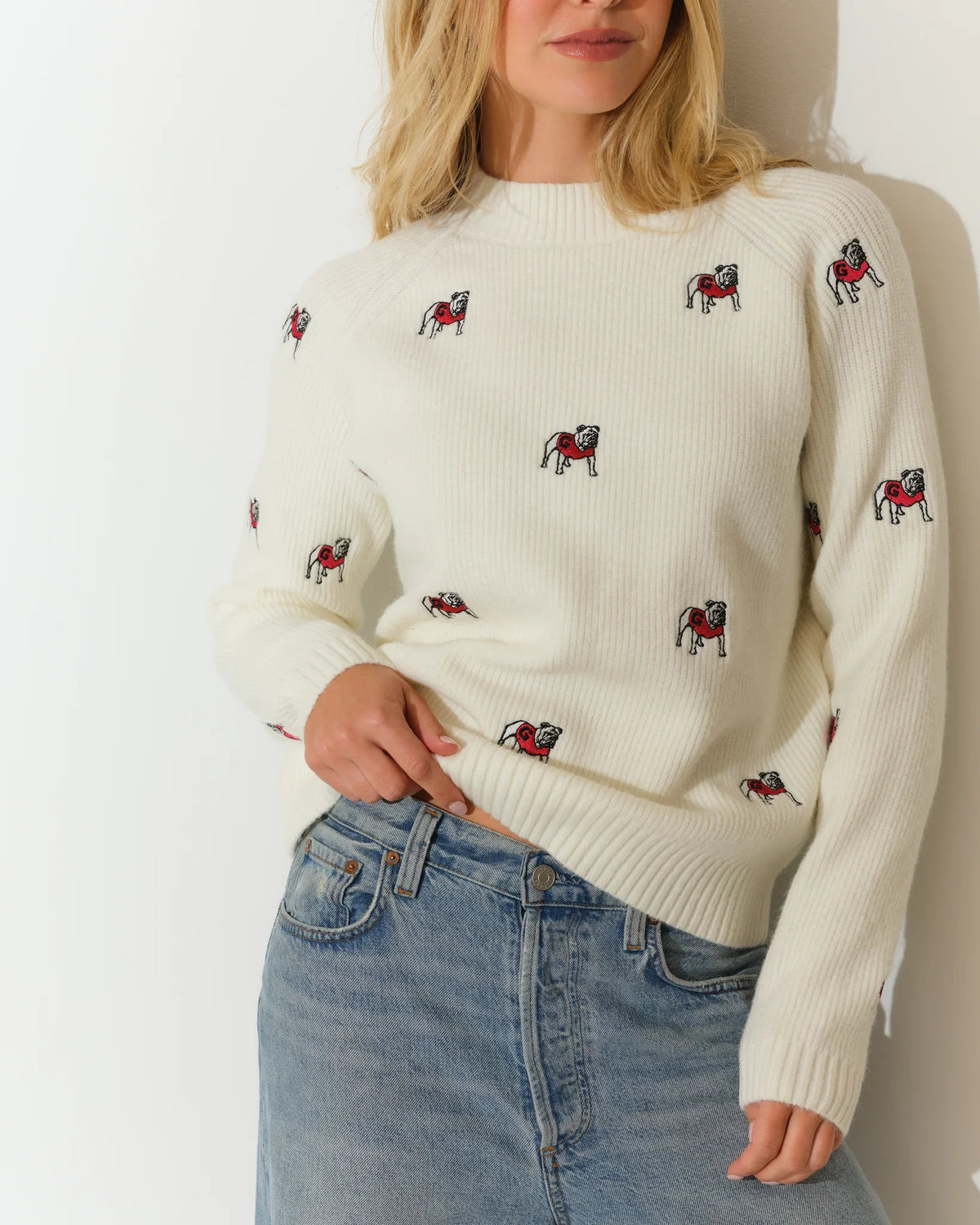 Ivory Georgia Bulldogs fisherman sweater with allover embroidered bulldog mascots, featuring a crew neck and ribbed hem.