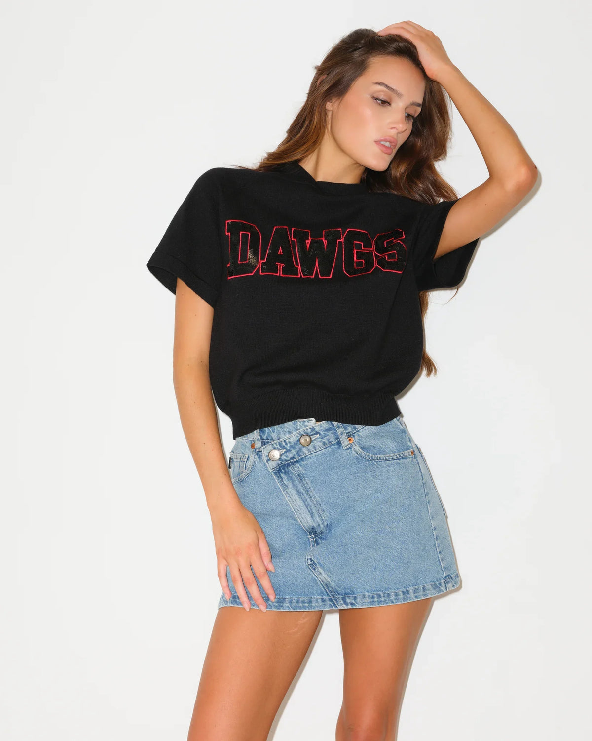 Black Georgia Bulldogs short sleeve shine knit hoodie with sequin team lettering, worn with a hood, styled casually.