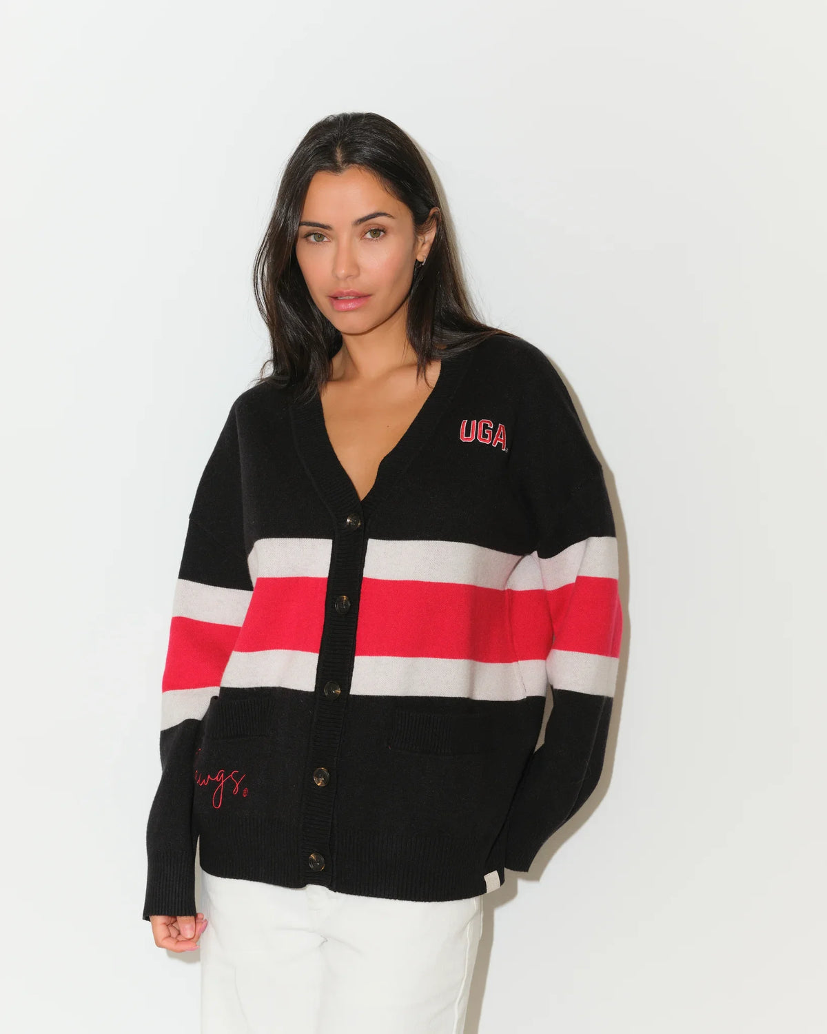 Black Georgia Bulldogs Vinti cardigan with bold red and white chest stripes, V-neck, button front, and embroidered "UGA" lettering.