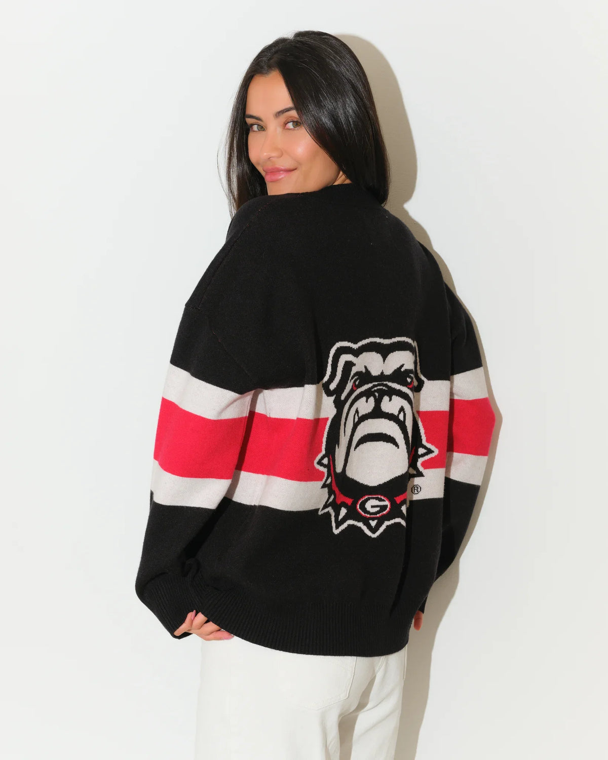 Black Georgia Bulldogs Vinti cardigan with bold red and white chest stripes, V-neck, button front, and embroidered "UGA" lettering.