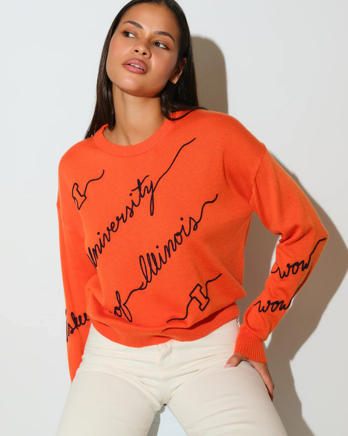 Orange Illinois Fighting Illini Love Letter Sweater with black cursive "University of Illinois" script across the front and sleeves.