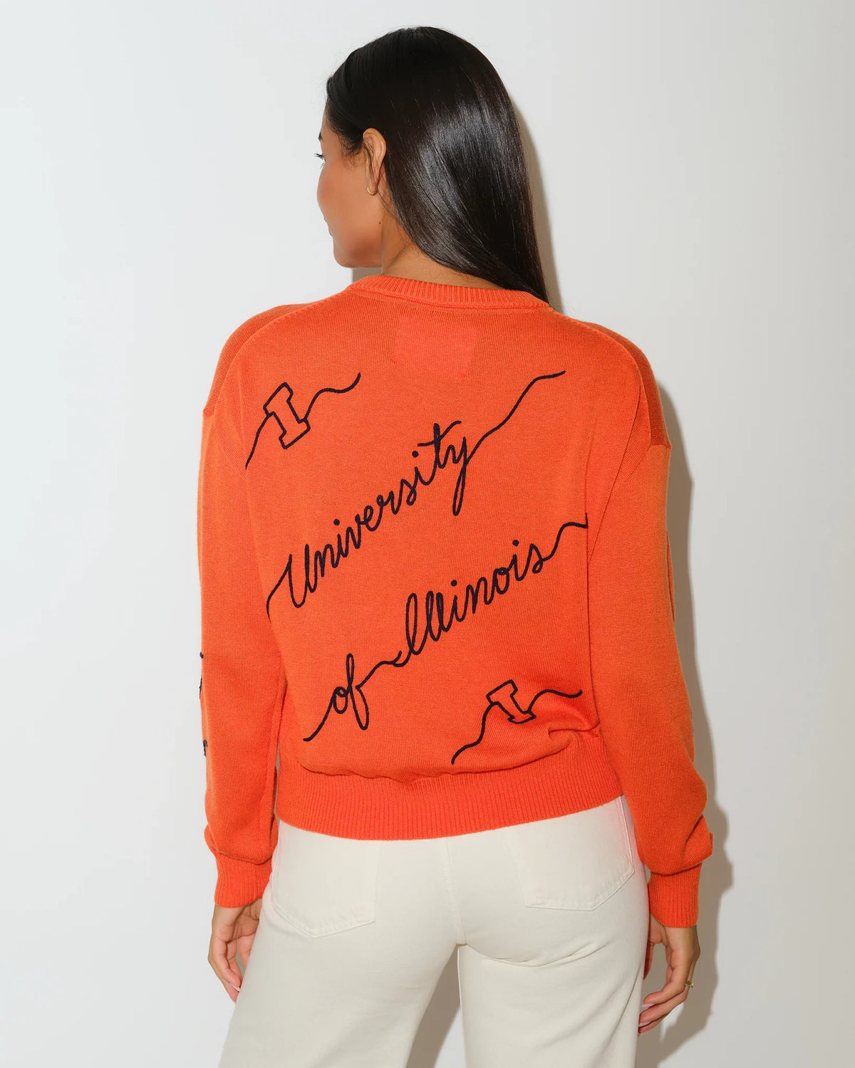 Orange Illinois Fighting Illini Love Letter Sweater with black cursive "University of Illinois" script across the front and sleeves.
