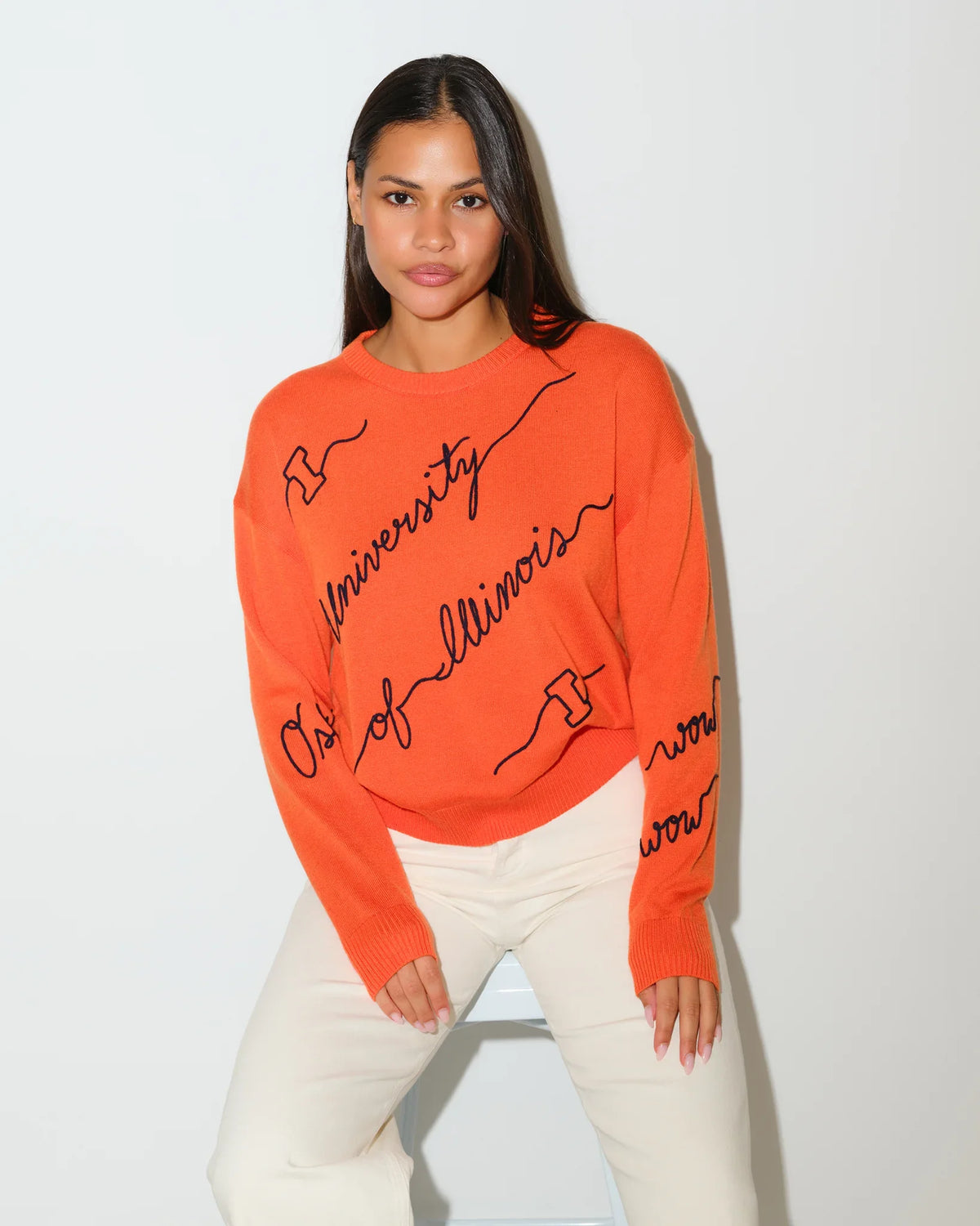 Orange Illinois Fighting Illini Love Letter Sweater with black cursive "University of Illinois" script across the front and sleeves.