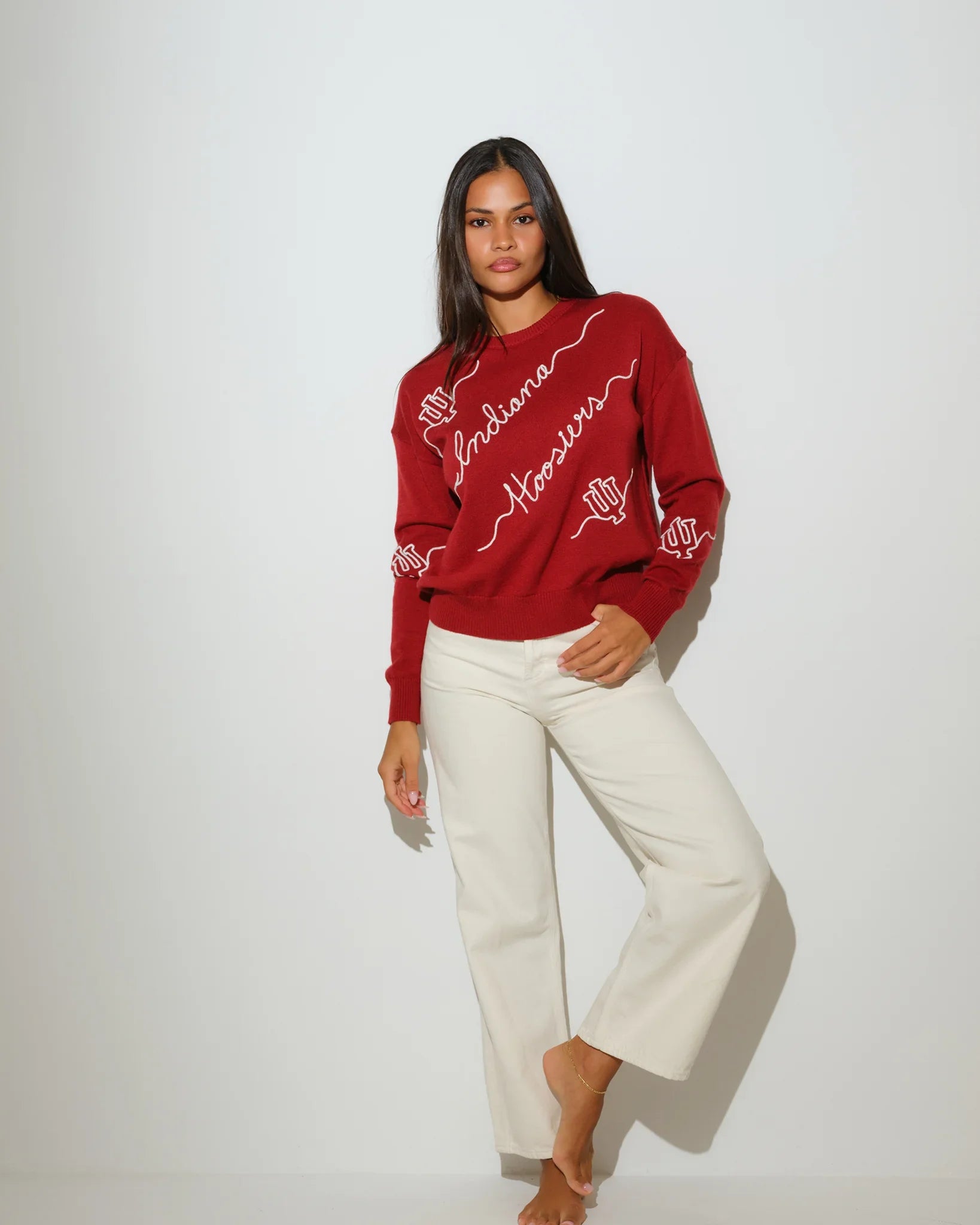 Crimson Indiana Hoosiers crewneck sweater with white script "Indiana Hoosiers" lettering and hand graphic across the front.