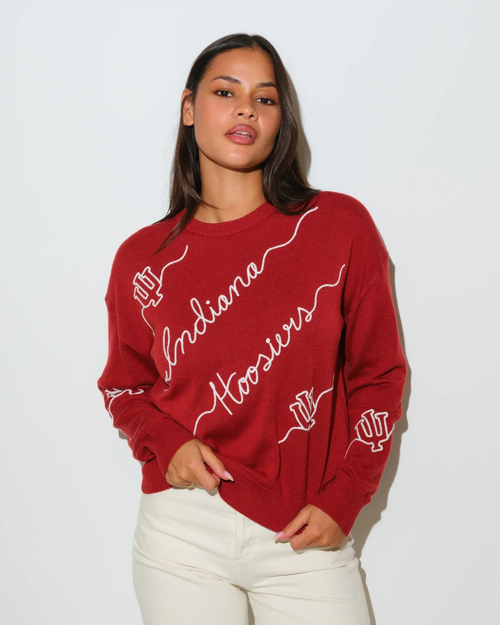 Crimson Indiana Hoosiers crewneck sweater with white script "Indiana Hoosiers" lettering and hand graphic across the front.