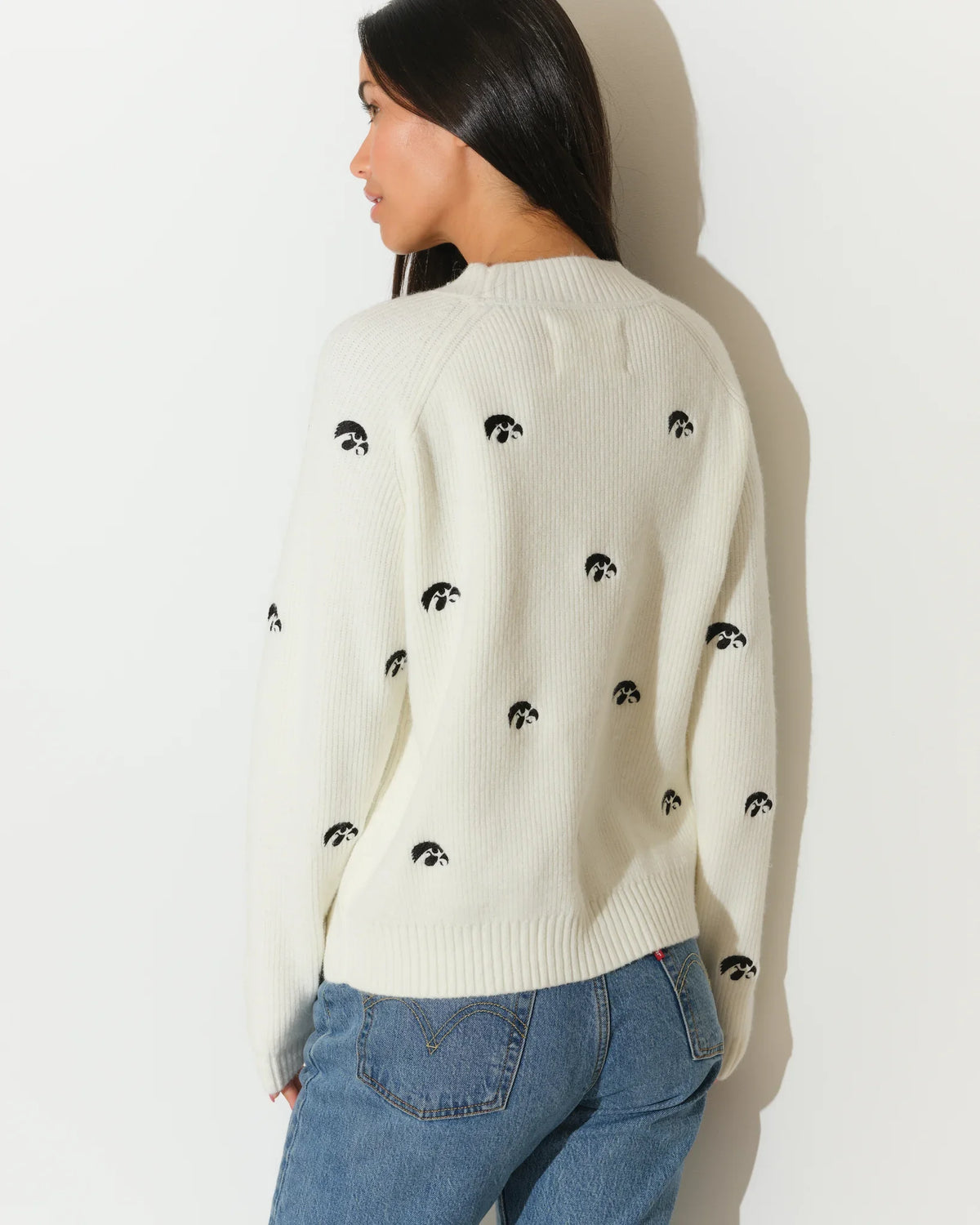 Ivory Iowa Hawkeyes fisherman sweater with allover embroidered Tigerhawk logos, shown in a relaxed crewneck knit style.