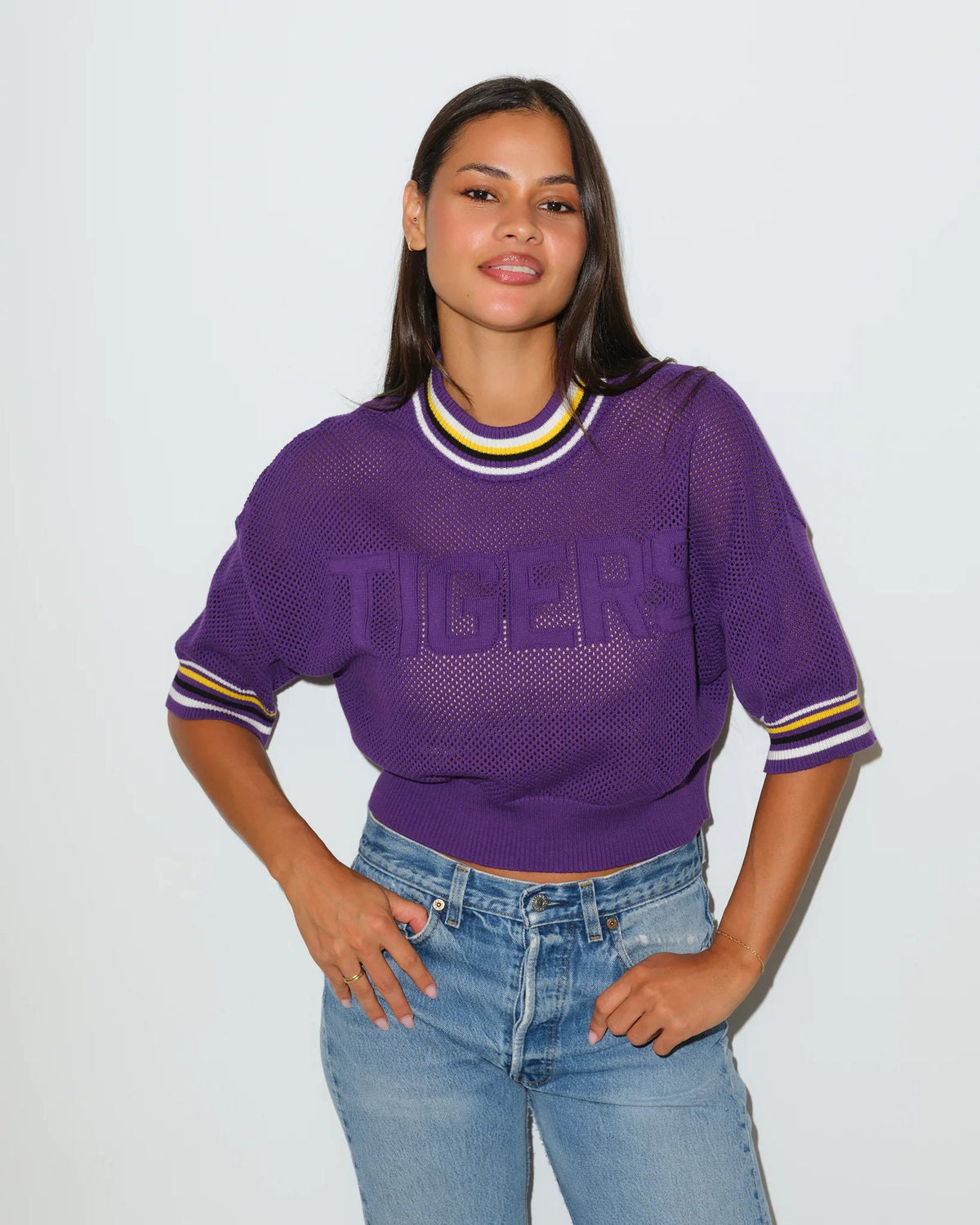 Purple LSU Tigers cropped summer sweater with "TIGERS" lettering across the chest and gold and white striped ribbed collar and cuffs.