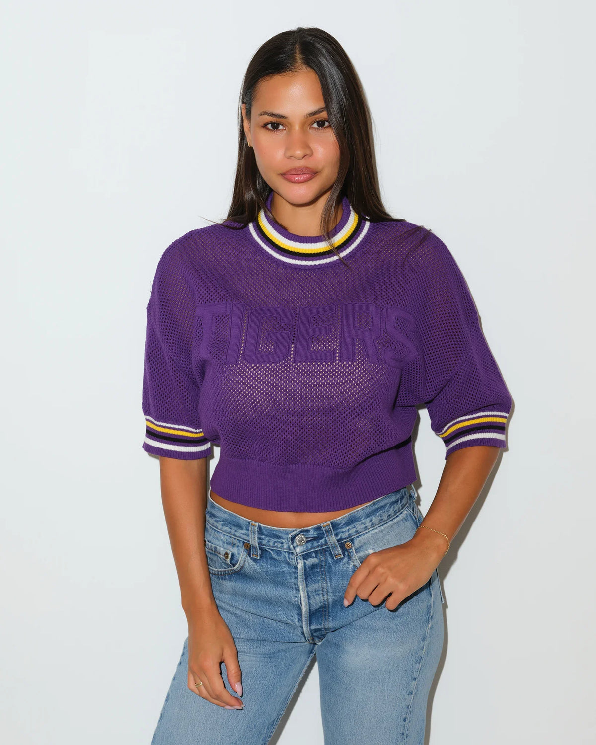 Purple LSU Tigers cropped summer sweater with "TIGERS" lettering across the chest and gold and white striped ribbed collar and cuffs.