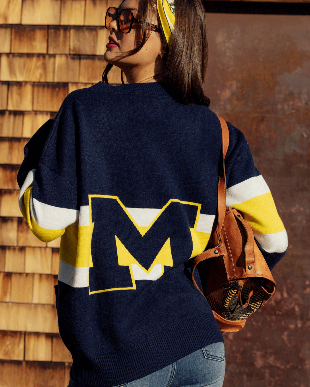 button-up cardigan with michigan wolverines embellishments and embrodiery styled for basketball games and campus wear