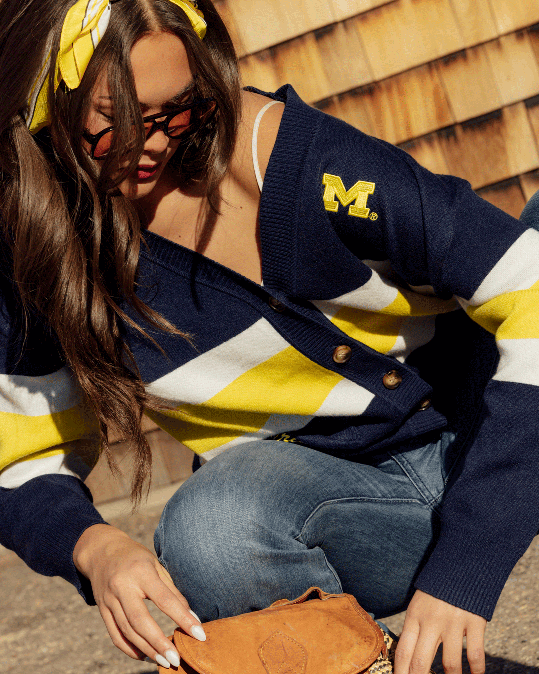 button-up cardigan with michigan wolverines embellishments and embrodiery styled for basketball games and campus wear