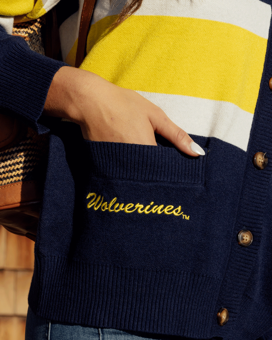 button-up cardigan with michigan wolverines embrodiery styled for basketball games and campus wear