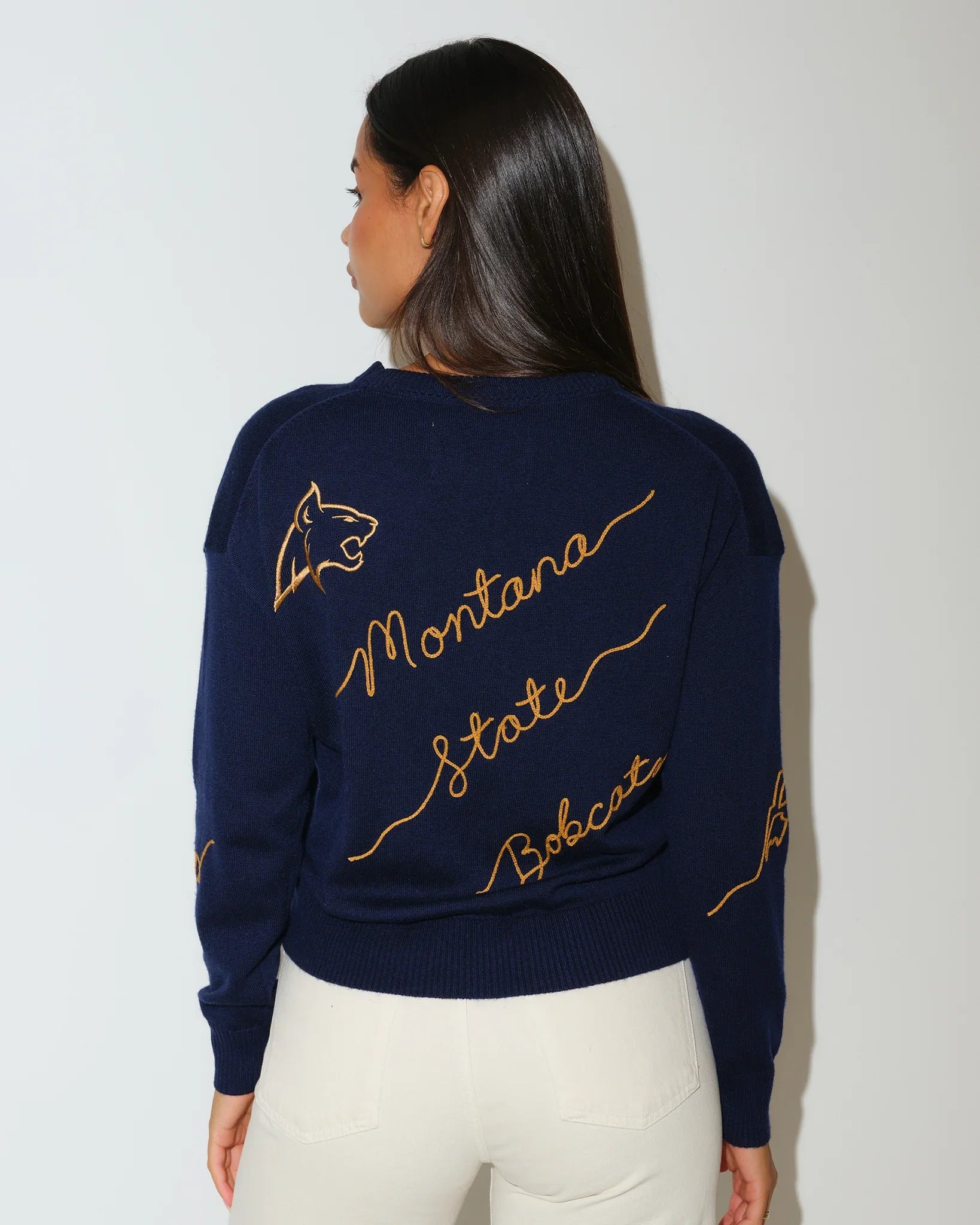 Navy Montana State Bobcats women's crewneck sweater with gold script "Montana State Bobcats" lettering across the front.