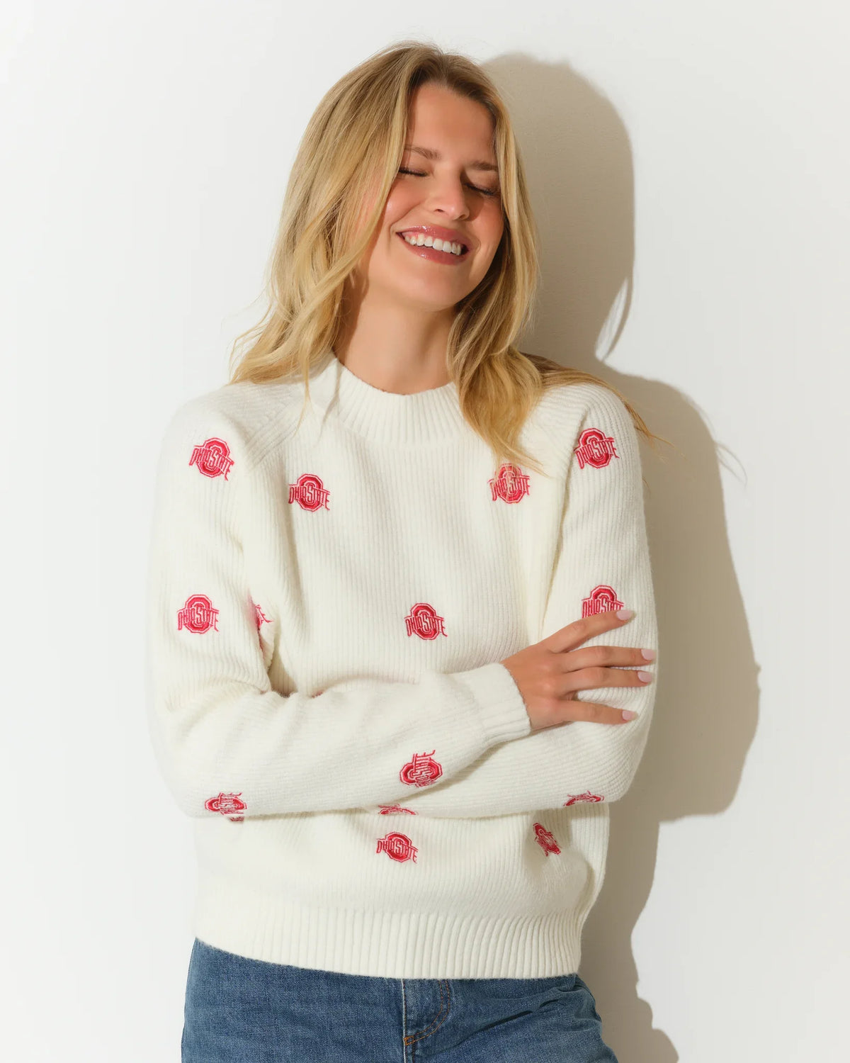 Ivory Ohio State Buckeyes fisherman sweater with scattered red Buckeye leaf embroidery, featuring a relaxed fit and ribbed cuffs.