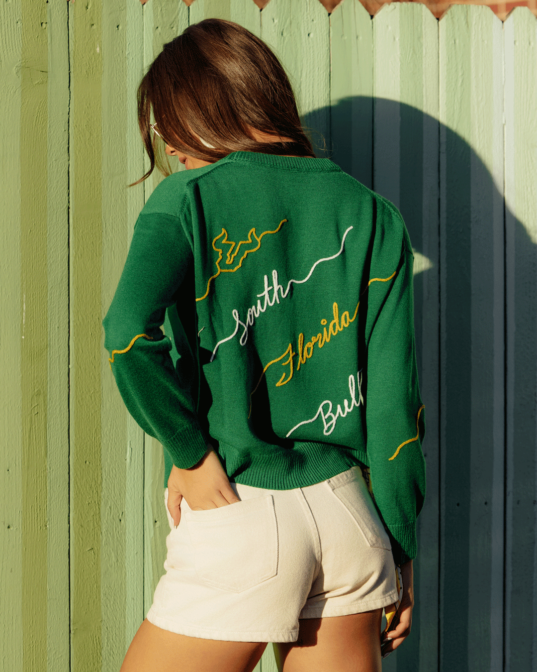 Green long sleeve love letter sweater with south florida bulls embroidery, perfect for game day.