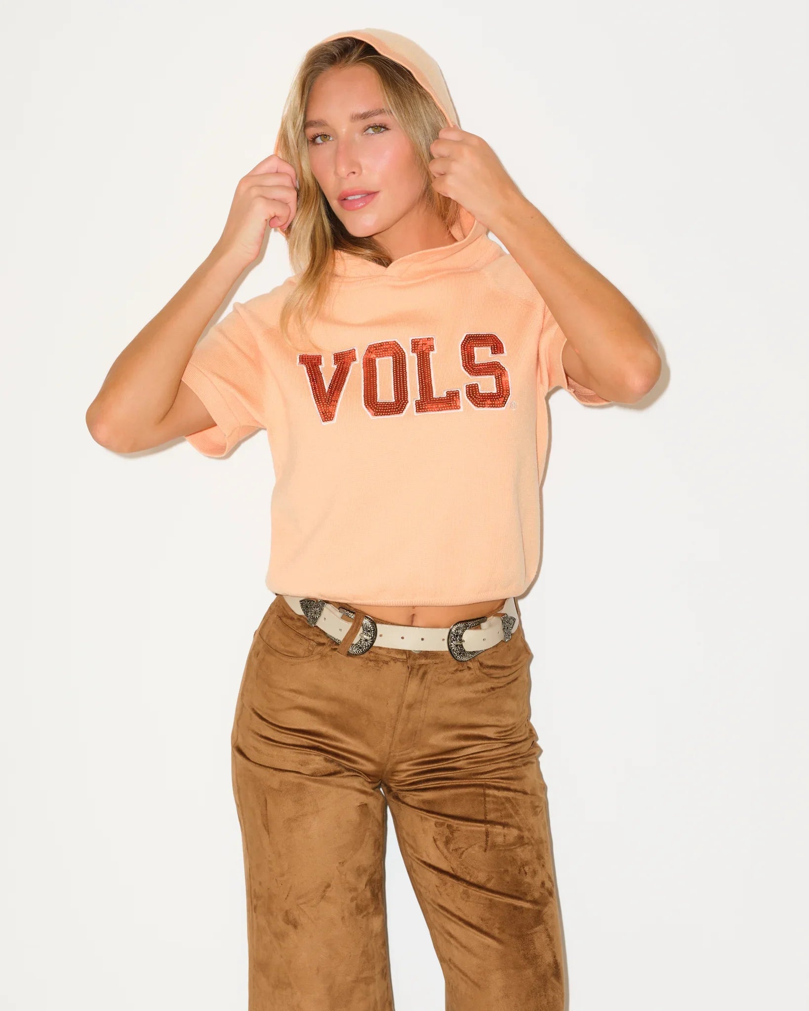 Tennessee Orange short sleeve knit hoodie featuring bold "VOLS" lettering across the chest in Tennessee team colors.