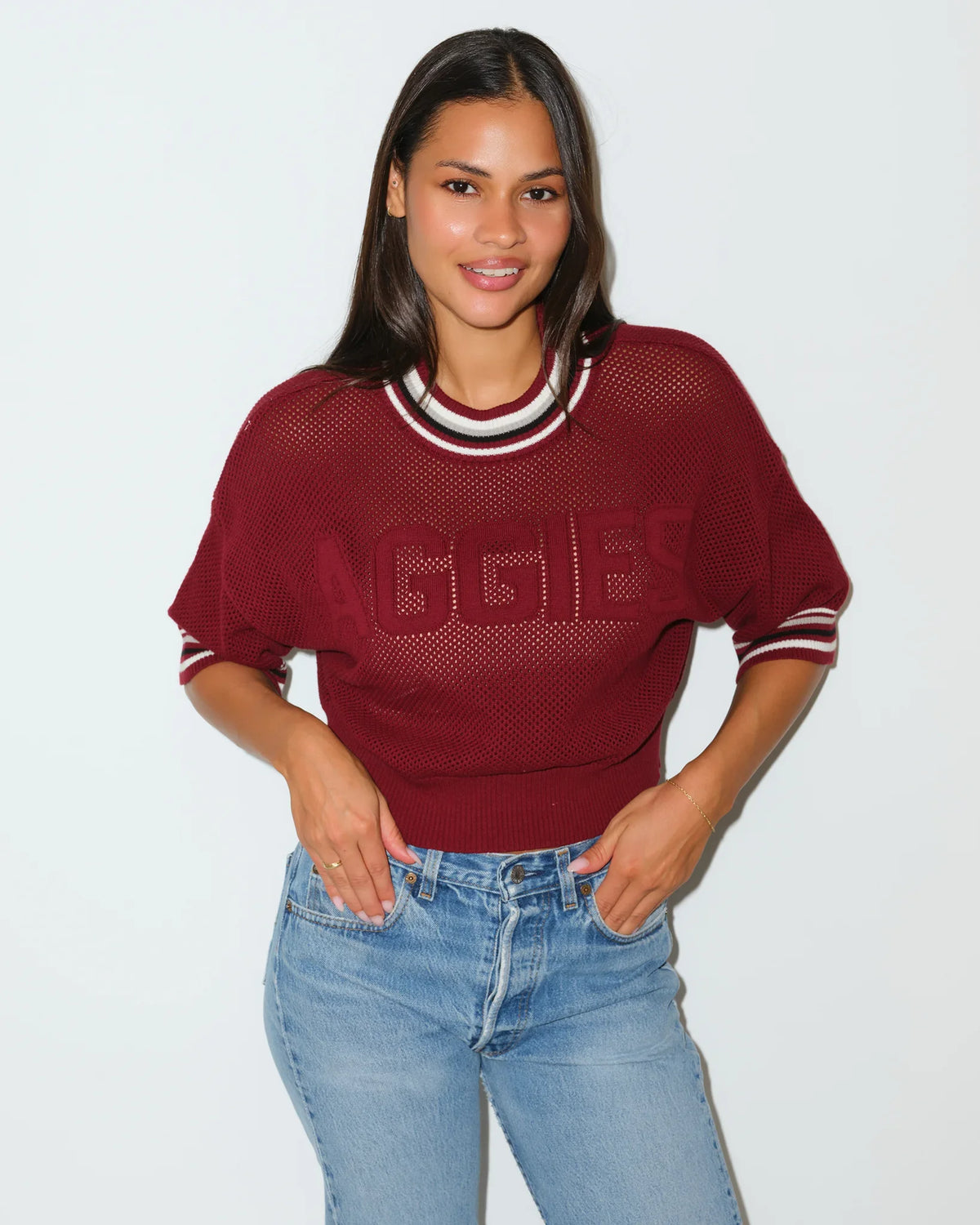 Maroon Texas A&M Aggies women's summer sweater with embossed "AGGIES" lettering, short sleeves, and striped ribbed collar.