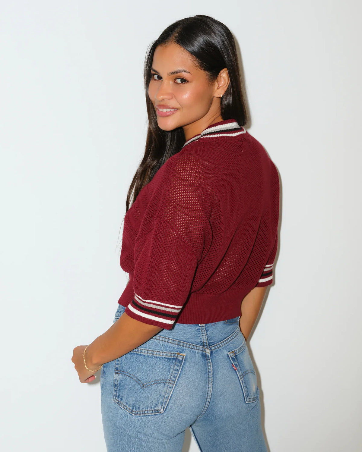 Maroon Texas A&M Aggies women's summer sweater with embossed "AGGIES" lettering, short sleeves, and striped ribbed collar.