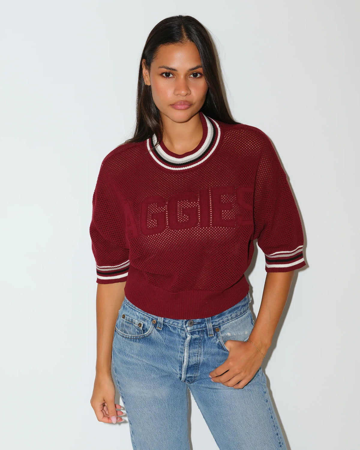 Maroon Texas A&M Aggies women's summer sweater with embossed "AGGIES" lettering, short sleeves, and striped ribbed collar.