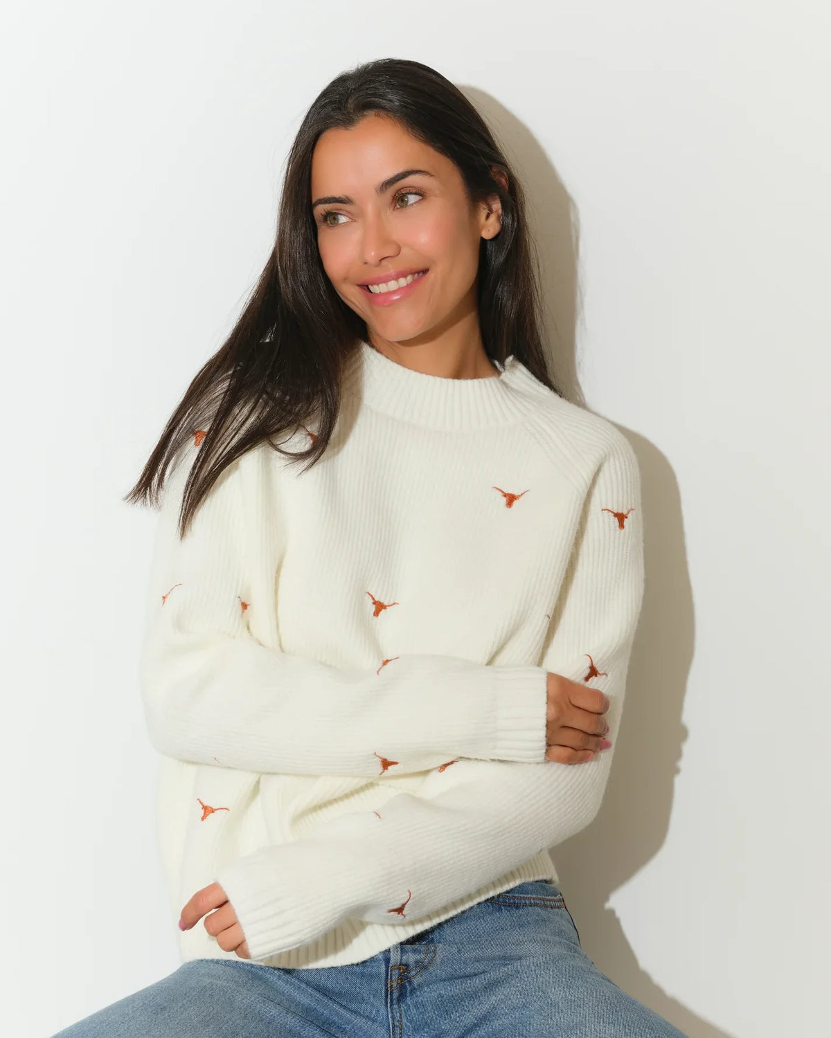 Ivory Texas Longhorns fisherman sweater featuring embroidered Longhorn logos, shown with a relaxed crew neck and ribbed cuffs.