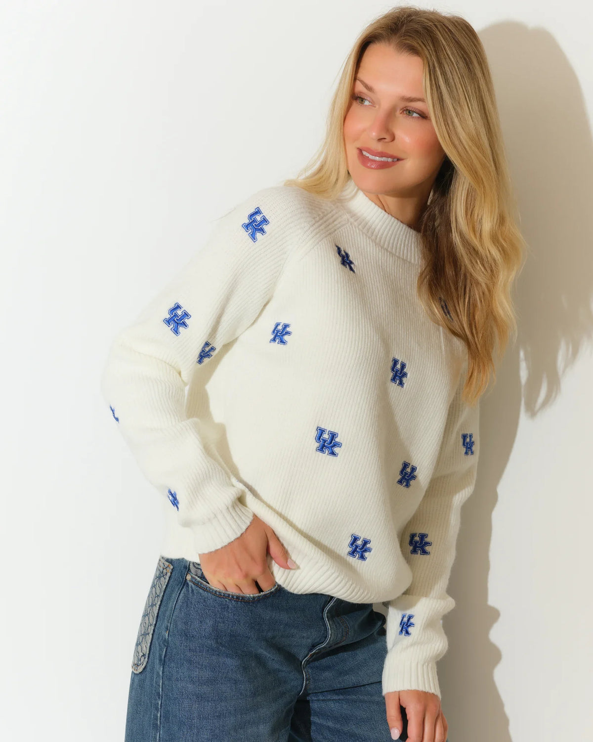 Ivory University of Kentucky fisherman sweater with allover blue UK logo embroidery, featuring a relaxed fit and mock neckline.