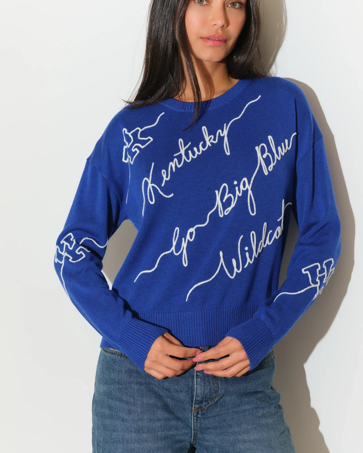Royal blue University of Kentucky Love Letter Sweater with white cursive "Kentucky Go Big Blue Wildcats" script and wildcat graphics on sleeves.